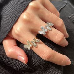 The Floating Butterfly Ring Set is two butterflies giving you the illusion of them floating on your finger. This unique design is eye catching and beautiful. The stones used in this ring are high quality Cubic Zirconia so it won't break the bank but will give you a Luxurious and Glamorous feel. Material: Full Sterling Silver 925Size of Butterfly: 10.2x10.4mmSize: Adjustable Water resistant Hypoallergenic Glazd Pouch with every order Free US shipping Easy Exchange & Return policy PRODUCT INFOThis Round Brilliant Engagement Ring, Gorgeous Wedding Bands, Rhinestone Material, Butterfly Ring, Wedding Ring Designs, Round Cut Engagement Rings, Engagement Rings Round, Cubic Zirconia Rings, Silver Wedding Rings