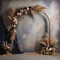 an arch decorated with flowers and grass for a wedding or reception ceremony is displayed in front of a backdrop