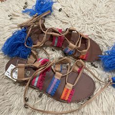 Brand: Brash Size: Women 7.5 Color: Brown With Blue, Pink, Orange, And Purple Material: Man-Made Condition: Brand New With Tags Great Pair Of Boho Sandals. These Are Brown And Gladiator Style. They Have Bright Colorful Embroidered Fabric On The Sides. The Adjustable Ties Have Large Blue Tassels. These Ties Finish Near The Ankle, They Do Not Go The Whole Way Up The Calf. Casual Brown Sandals With Tassels, Bohemian Fringe Sandals For Beach, Womens Gladiator Sandals, Boho Sandals, Blue Tassel, Embroidered Fabric, Sandal Women, Orange And Purple, Gladiator Sandals