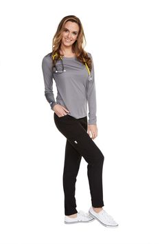 The Women’s Long Sleeve Antimicrobial Under Scrub Top is a lightweight undershirt with a streamlined silhouette. Constructed of super soft polyester, this top offers breathability and moisture wicking properties that keep you protected and confident throughout your shift and beyond. Perfect for layering, yet suitable for solo wear.Fabric: 100% PolyesterRounded neck Fashionable Scrubs, Nursing Outfits, Nursing Station, Nursing Style, Nurse Outfit Scrubs, Medical Scrubs Outfit, Stylish Scrubs, Nurse Shoes, Nursing Scrubs