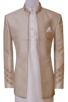 👑 Step into the realm of prosperity with our Golden Raw Silk Fabric Open Front Luxury Prince Coat! ✨🕴️ Crafted with exquisite raw silk fabric, this coat exudes elegance and regality. The open front design adds a contemporary twist to the traditional prince coat, making it a statement piece for any formal occasion. For online order and prices plz visit: https://uomoattire.com/products/golden-raw-silk-fabric-open-front-luxury-prince-coat or ☎️ Call/WhatsApp on +1 (516) 853-3280 #PrinceCoat #Luxu Luxury Designer Gold Nehru Jacket, Luxury Brocade Sherwani For Men, Luxury Raw Silk Bandhgala With Gota Work, Luxury Gold Nehru Jacket, Elegant Style, Elegant Embellished Nehru Jacket With Long Sleeves, Gold Embroidered Silk Sherwani, Designer Long Sleeve Gold Outerwear, Silk Sherwani With Gold Embroidery For Wedding, Gold Sherwani With Intricate Embroidery For Party