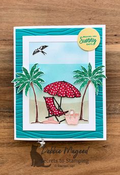 a card with an umbrella and beach scene