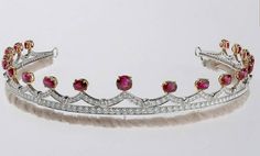 a tiara with pink and white stones on it