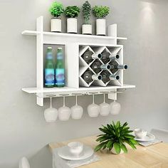 a white shelf with wine glasses and bottles on it