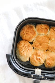 a pan filled with rolls sitting on top of a table