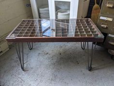 a table that has some plates on it in the middle of a room with other items