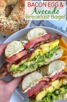 a person holding a plate with sandwiches on it and bagels in bowls behind them