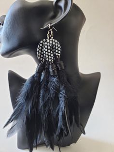 Add a touch of boldness to your outfit with these gorgeous double feather earrings.  Length:6in Lightweight, long FYI ➡️ Proper care and storage will help extend the life of your jewelry. Black Feathered Jewelry For Festivals, Trendy Black Earrings For Festivals, Trendy Black Festival Earrings, Elegant Black Feather Jewelry, Handmade Black Earrings, Bohemian Black Feather Earrings, Black Pierced Earrings For Festival, Black Feather Jewelry For Party, Black Feathered Jewelry For Party