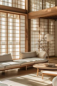 a living room filled with furniture and windows