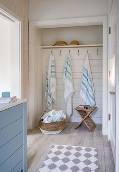 a bathroom with towels hanging on the wall