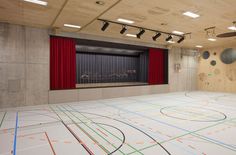 an indoor basketball court with multiple lines on the floor