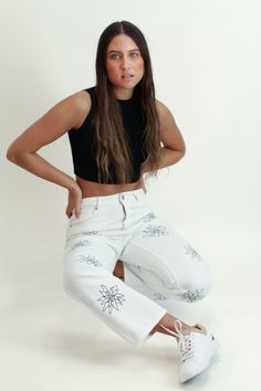 This is a 100% Cotton, Jean. It is embroidered with our signature brand logo flower. It fits mid-waist with wide-leg at the bottom of the jean. It can be styled in many ways and weather. Mix and match with some sneakers, boots, or heels. Trendy Wide Leg Bottoms With Floral Embroidery, Trendy Floral Embroidered Wide Leg Bottoms, Embroidered Jeans For Streetwear, White Embroidered Jeans For Spring, Spring White Embroidered Jeans, White Embroidered Cotton Jeans, Logo Flower, White Embroidery, Sneakers Boots