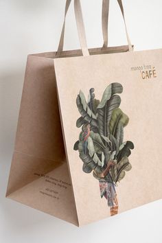 a brown paper bag with a plant on it