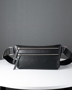 This black leather chest bag is created for those of us who want to ensure their most important accessories are kept secure and close at hand at all times. The long adjustable strap ensures that this crossbody bag can fit most body sizes.It's a black chest bag that is suitable for a broad variety of uses. It can be worn every day or when traveling, it's also a practical choice when going to a festival or sporting event. A large general department 2 pocket on the outside 2 pockets inside Reliable Black Leather Backpack With Mobile Phone Bag, Modern Crossbody Chest Bag For Everyday Carry, Modern Everyday Carry Crossbody Chest Bag, Modern Everyday Crossbody Chest Bag, Black Leather Backpack With Adjustable Strap For Everyday, Black Leather Chest Bag For Travel, Black Crossbody Chest Bag For Everyday Carry, Soft Leather Crossbody Chest Bag For Everyday Carry, Black Crossbody Chest Bag For Everyday