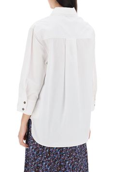 This Ganni shirt is made of organic cotton poplin and features an oversized fit. It has a collar, button closure, chest pocket, small tonal embroidered logo, side slits, and an asymmetrical cut. The model is 177 cm tall and wears size 34. Composition: 100% ORGANIC CO Oversized Poplin Tops For Spring, Relaxed Fit Poplin Button-up Top, Relaxed Fit Long Sleeve Poplin Blouse, Cotton Blouse With Fold Down Collar For Daywear, Oversized Poplin Button-up Top, Casual Poplin Blouse For Workwear, Fall Poplin Button-up Tops, Fall Poplin Shirt, Cotton Blouse With Roll-up Sleeves For Daywear