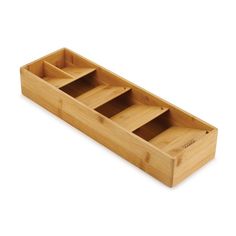 an empty bamboo tray with three compartments