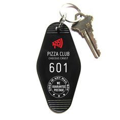 a black keychain with the number 6001 on it and a white background