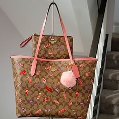 Euc....This Tote Collection Is So Cute. It Is There, Candy Print. It Is Such A Fun And Colorful Bag. In A Beautiful Pink And Khaki There Is A Little Scuff Mark On All Four Corners Of This Tote, But That Happens With All Of Coach's City Totes. Please Look At The Above Pictures. There Are No Other Dents, Dings, Or Scratches That I Can Find On This Bag. I Am Including The Wristlet And A Matching Pink Wallet. I Will Also Keep The Pink Pom Pom On The Front As Well. If You Would Like Me To Keep The Or Candy Print, Coach Tote Bag, Pink Pom Pom, Pink Wallet, Coach Tote Bags, Pink Tote Bags, Coach Tote, Colorful Bags, Fancy Bags