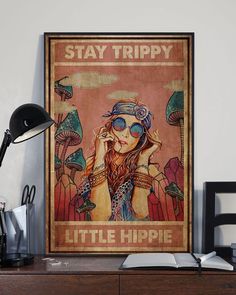 a poster that says stay trippy little hippie on the wall above a desk