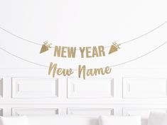 a new year's eve banner hanging from a string on a wall in a living room