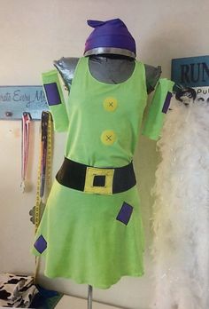 a green dress with purple and yellow accents