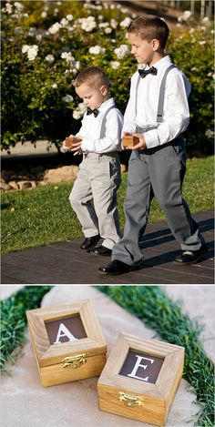 two young boys dressed in formal wear standing next to each other with their initials on them