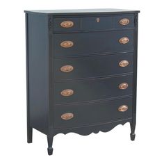 a black dresser with gold knobs on the top and bottom drawers, against a white background