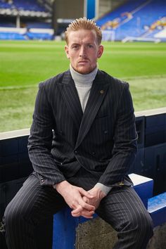 Suit up in style with the Rocco suit, as worn by Everton's goalkeeper Jordan Pickford. Introducing Rocco, the must-have double breasted suit with a distinctive navy pinstripe. Indulge in luxury with this timelessly sophisticated two piece suit, tailored from premium fabric with an elegant slim fit that will make a striking impression. Exude class and sophistication with Rocco. Model wears size 40R blazer & 34R trousers. Features Slim fit Peak lapel Single back vent Four button cuff Double-breast Jordan Pickford, Navy Suit Wedding, Blazer Wedding, Wedding Blazers, Peaky Blinders Suit, Graduation Suits, Tweed Wedding Suits, David Allen, Wedding Waistcoats