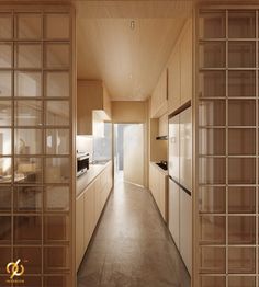 a long narrow kitchen with wooden cabinets and glass doors