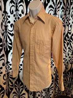 No label, soft af vintage button down mod / Rockford files / Stephen Malkmus / You This is a really comfortable shirt and it is totally perfect for reeling or rocking. Business or pleasure.  Butterscotch color with white and blue stripes. Feels good,like home. Pit to pit it's about 20.5 check the pic. Vintage Brown Shirt For Spring, Striped Collared Shirt For Fall, Vintage Striped Shirt For Fall, Striped Fitted Shirt For Fall, Fitted Striped Shirt For Fall, Fall Striped Collared Shirt, Cotton Shirt With Vertical Stripes For Fall, Fall Cotton Shirt With Vertical Stripes, Classic Striped Shirt For Fall