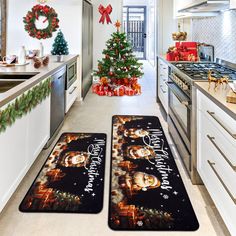 two christmas themed kitchen rugs in the middle of a kitchen with holiday decorations on the counter