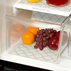 an open refrigerator filled with fruit and juice