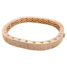 This stunning two section 18 karat rose gold bangle style bracelet is accented with 171 carefully matched white round brilliant diamonds weighing approximately 4.16 carat total. Inspired by art and fashion, Novel Collection is presenting its creativity and superlative craftsmanship. Absolutely unique pattern is reproduced in a retro design; easy to wear and highly versatile, this elegant concept will touch your essence. This piece was Hand made at the Novel Collection Jewelry Atelier, specializes in rare collectible pieces in Fancy color diamonds. Please inquire for additional details. We also have stock of other investment pieces which are unlisted. Kindly send us a message and we will be glad to respond with the piece that meets your description. Novel Collection is a recognized leader a Diamond Bangle In Rose Gold With Pave Setting, Rose Gold Diamond Bangle With Pave Setting, Rose Gold Bangle With Pave Setting, Rose Gold Diamond Bracelet With Pave Setting For Wedding, Rose Gold Pave Diamond Bracelet For Wedding, Luxury Rose Gold Diamond Bracelet With Pave Setting, Formal Rose Gold Diamond Bracelet With Pave Setting, Rose Gold Diamond Bangle With Single Cut Diamonds, Rose Gold Diamond Bracelet With Pave Setting