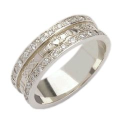 a wedding ring with two rows of diamonds on the side and an intricate design in the middle