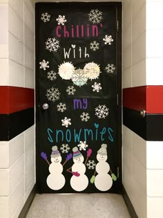 a door decorated with snowmen and words