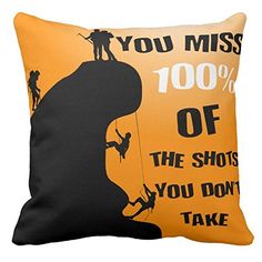 a pillow with an image of a climber on the top of a mountain, saying you miss 100 % of the shots you don't take