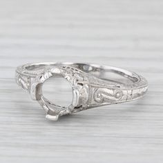 an antique style engagement ring in white gold