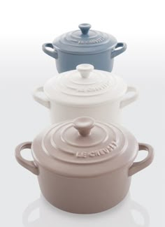 three pots with lids on each one