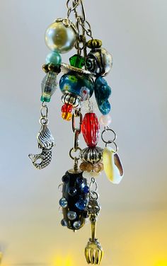 a close up of a key chain with many different items hanging from it's ends