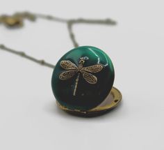 An authentic vintage brass locket features a stunning dragonfly against a turquoise enamel.  This piece opens to hold two photographs that we place for you (see below for details).~Locket measures 1"~Comes on a 24" brass chainADDITIONAL NOTES:*This locket includes custom photo placement!  After you’ve purchased the item, send us your digital photos using the Etsy conversation feature.  Please note that we will crop to size but do not offer any additional editing.*Our art lockets are handmade usi Layering Jewelry, Moon Phases Necklace, Dragonfly Jewelry, Glass Locket, Digital Photos, Vintage Lockets, Unique Necklace, Layered Jewelry, Close To My Heart