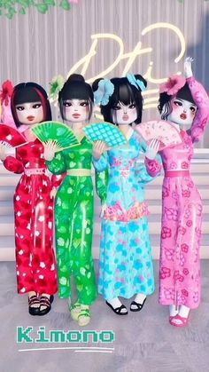 three women in colorful kimonos standing next to each other with their hands on their hips