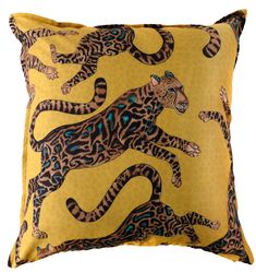 a yellow pillow with leopards on it