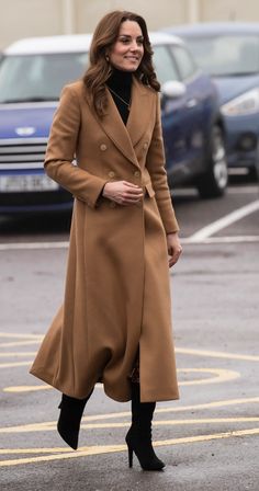 the duke and duchess of cambridge are seen walking through an empty parking lot in london