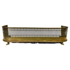 an antique brass planter with ornate design