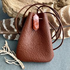 "Leather Medicine Bag, Shaman Bag or Amulet Pouch to wear around your neck-or hang in your Car! Perfect for Ceremony or to wear to a Festival...or even to wear everyday! These are made from the last few pieces of soft Brown Leather I have. There's a bit of variety,as you can see in the Video. The Stones have variety too-that's the beauty of these particular Stones! 2 Color Choices: *The Dark Chocolate features very large pieces Montana Agate. *The Rusty Brown has my favorite Stone-Lepidocrocite Small Mobile Phone Bag As Gift, Brown Bohemian Bag For Personal Use, Bohemian Brown Bag For Personal Use, Handmade Pouch Bags For Personal Use, Small Handmade Shoulder Bag For Gift, Gift Crossbody Pouch With Removable Pouch, Small Handmade Shoulder Bag As Gift, Gift Pouch Shoulder Bag For Mobile Phone, Rectangular Brown Pouch For Gift