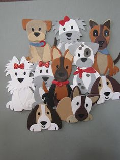 a bunch of cut out dogs sitting on top of a table