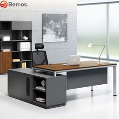 an office desk with a laptop on it