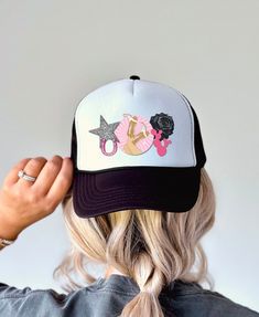 Looking for a fun retro western trucker hat? This is the perfect black and pink themed trucker cap for summer!  The design is printed directly onto the hat but is designed to look similar to a trucker hat with patches! Do you want a custom hat design? Reach out for a custom order! .: Material: 100% polyester foam front with 100% nylon mesh weave back .: One size fits most (22.8"/58cm) .: Seven color combinations to pick from .: Adjustable plastic snap closure .: Six row stitching on visor .: Please note: Creases on the hat will straighten out naturally once unpackaged and worn Cute Black Baseball Cap With Curved Brim, Black Fun Trucker Hat With Flat Brim, Cute Black Snapback Baseball Cap, Trendy Black Trucker Hat For Party, Cute Adjustable Black Baseball Cap, Cute Black Baseball Cap, Black Snapback Trucker Hat For Party, Cute Black Mini Hats One Size, Black Trucker Hat For Party With Curved Brim