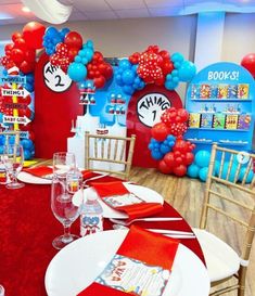 the dr seuss birthday party is decorated with red, white and blue balloons