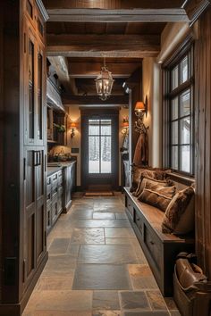 a long hallway with wood paneling and stone flooring